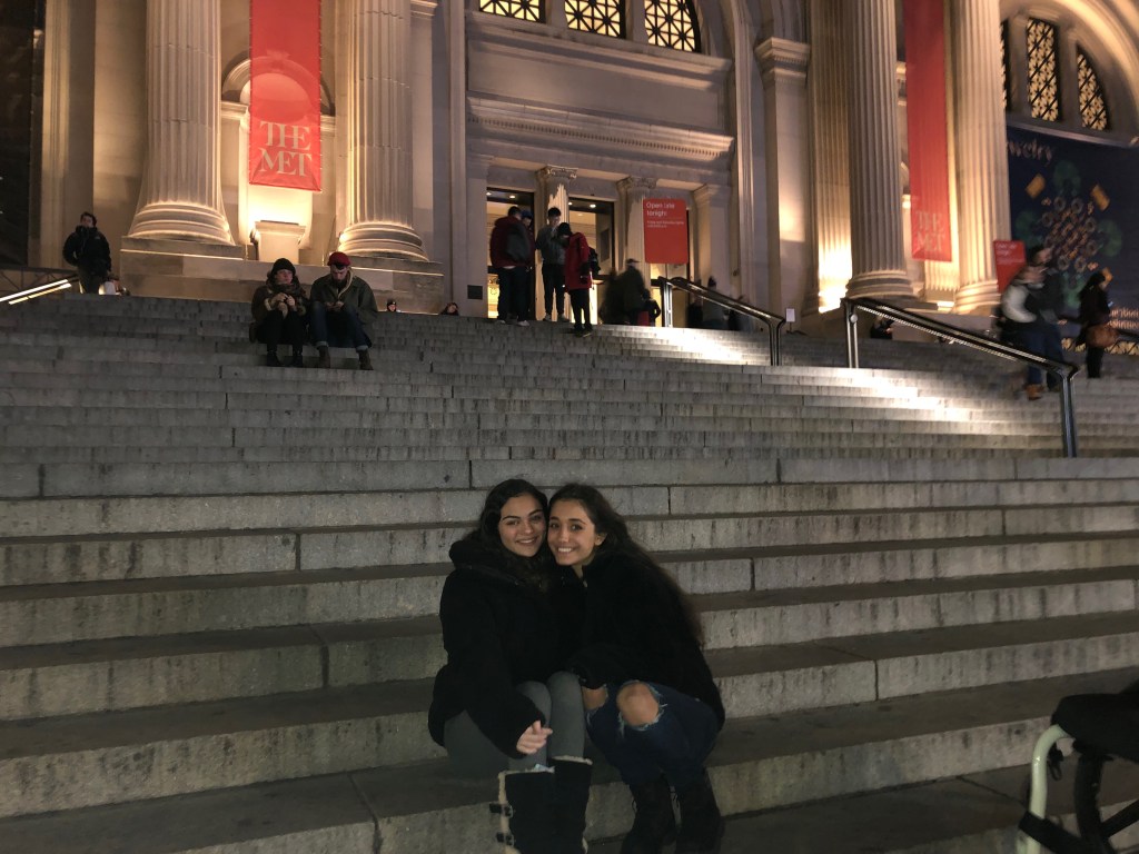 My friend and I sitting on the museum steps.