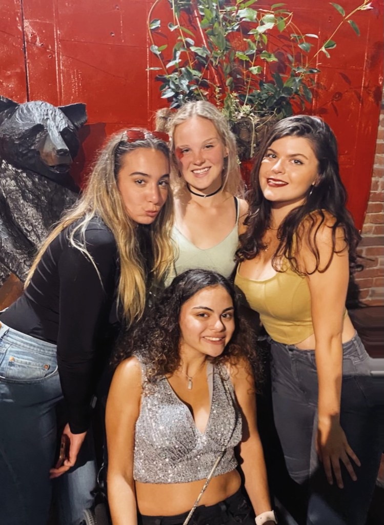 My college friends and I dressed up at a bar.